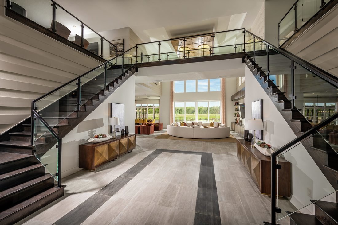 laurel pointe model with large staircase surrounding main hallway